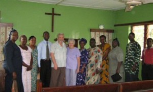 The Philpotts with a group in a church