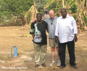 Standing beside the seminary wellhead are Professor Joseph Ilori (left), NFW council member Jon Low and Sabatek's Tunde Adenowo. Sabatek is the company that drilled the well